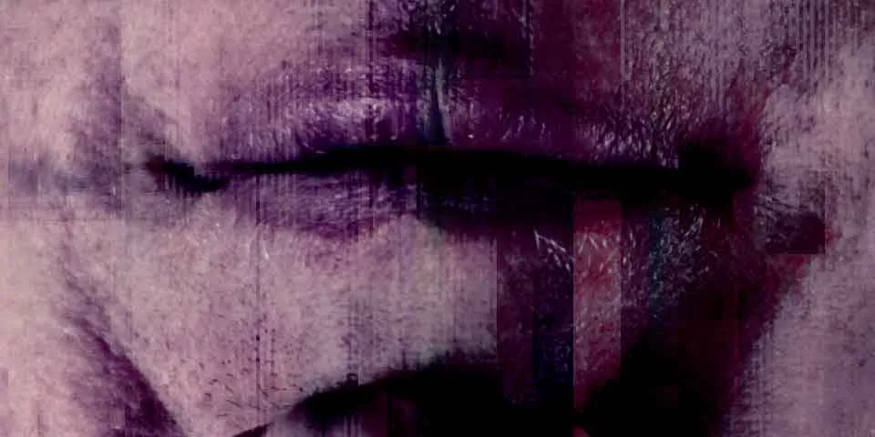 An extreme close-up of closed lips in purple tones, streaked with vertical glitch bands.